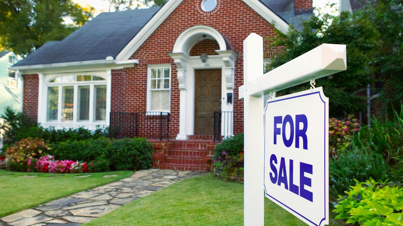 home for sale with sign out front